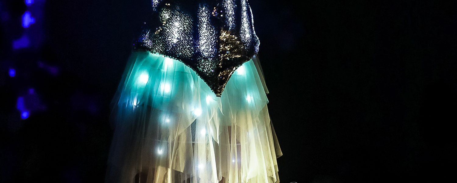 Sequin LED costume dress with teal LEDs in a tulle skirt — beginner DIY wearable tech project