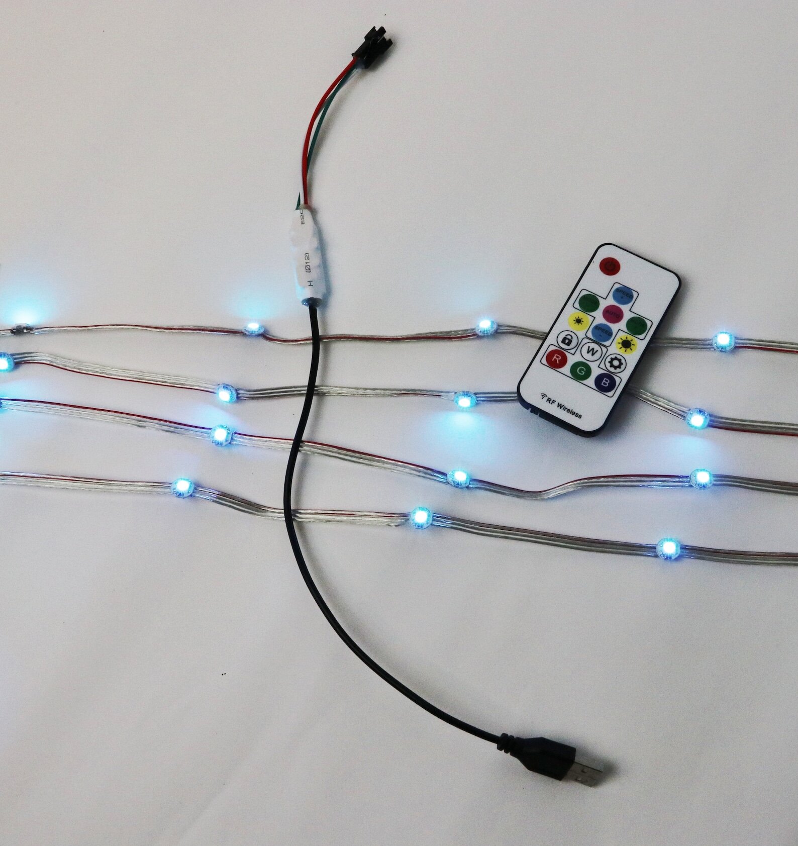 DIY LED Starter Kit flexible strand attached to fabric, showing the reinforced LED strip and USB connection