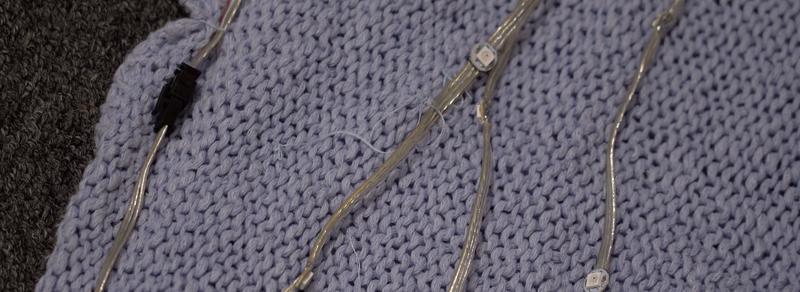 Two LED wearable kits connected together for brighter light-up sweater
