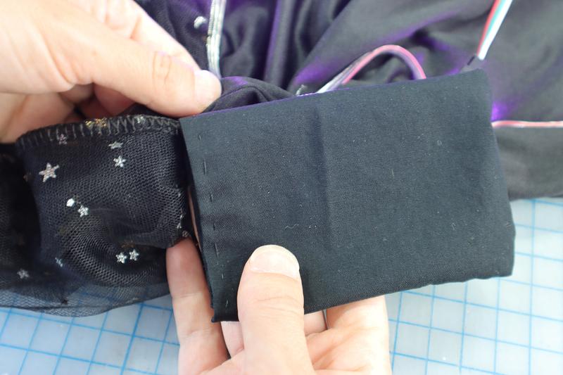 Battery pocket attached to skirt