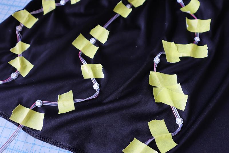 LED placement under sheer skirt fabric for wearable light-up effect