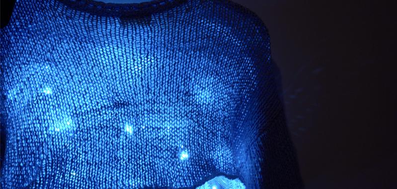 Finished DIY LED sweater glowing with colorful wearable lights